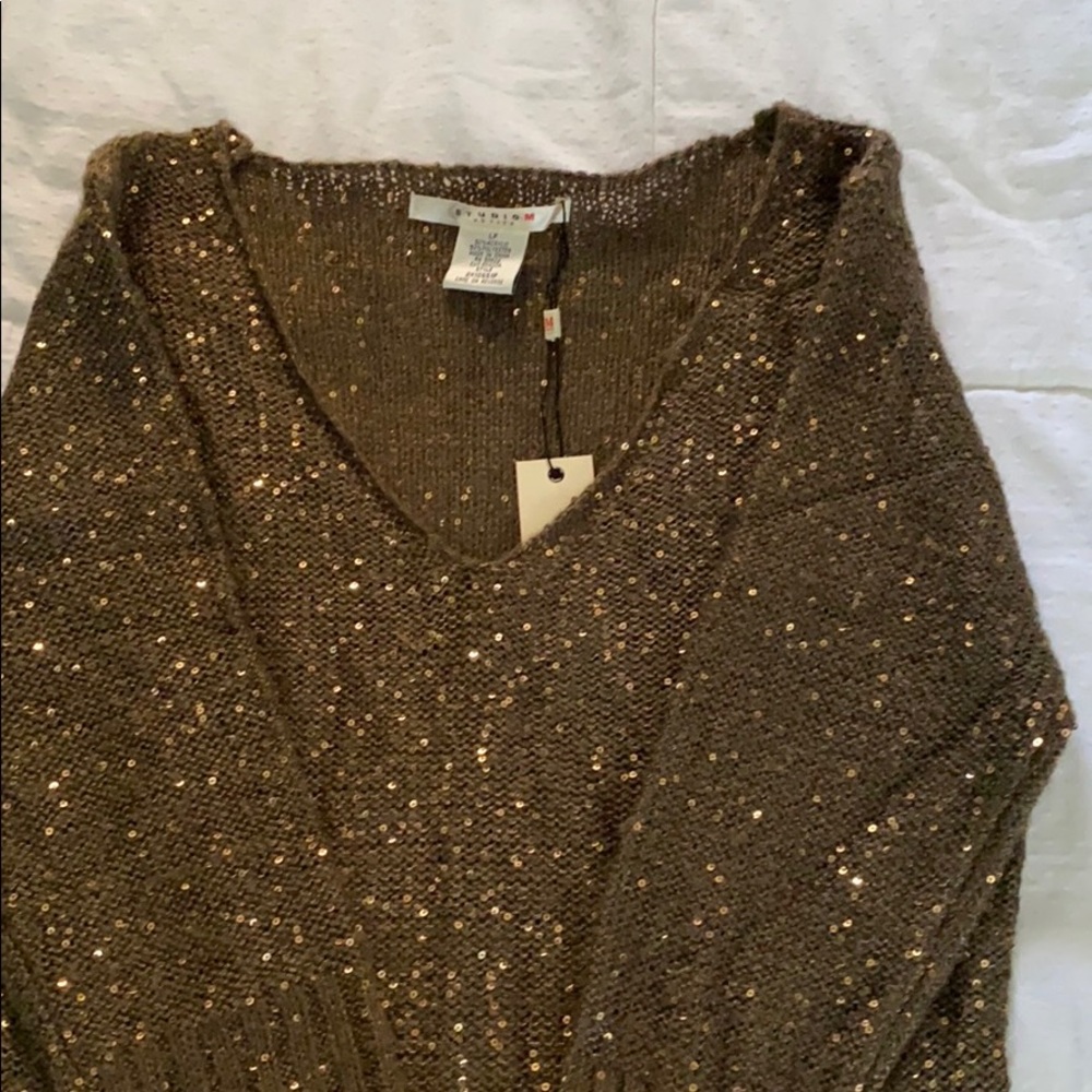Brown sequences brand new tunic.